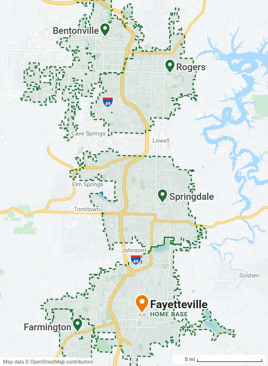 Map of Northwest Arkansas with the city limits of Fayetteville (home base), Farmington, Springdale, Rogers and Bentonville outlined in green along I-49, and Beaver Lake to the east